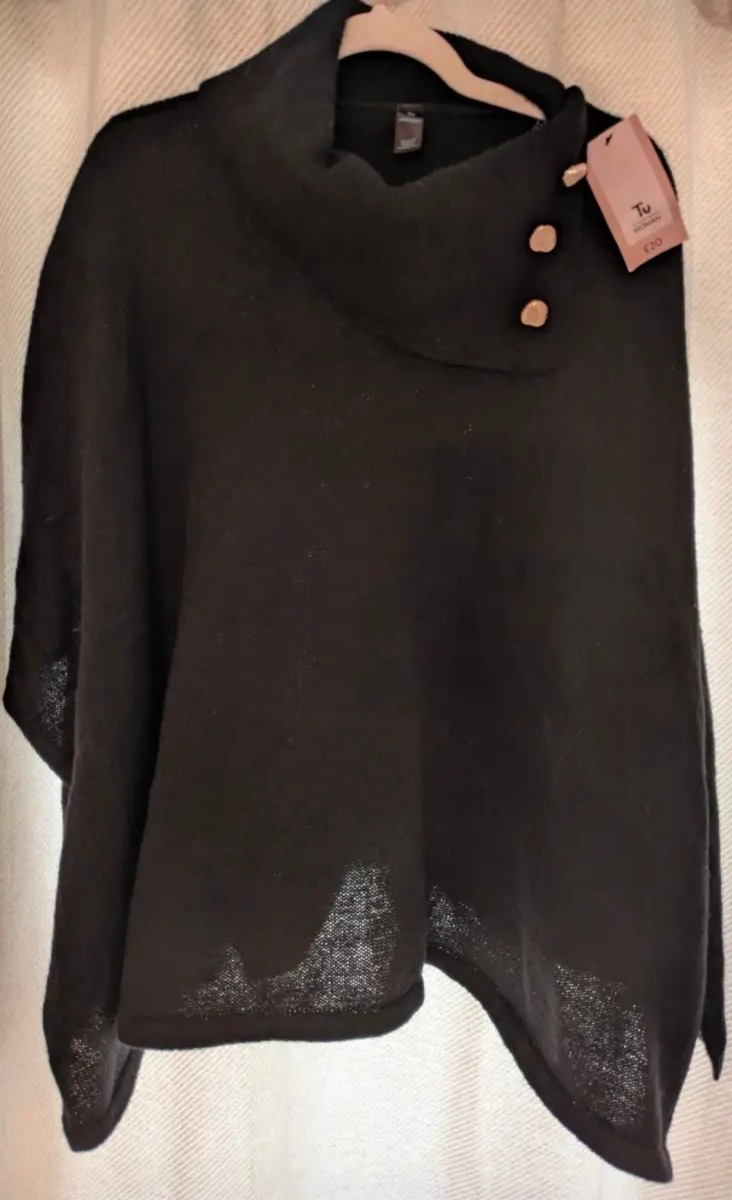 New with tags TU Woman black knitted poncho/cape. One size