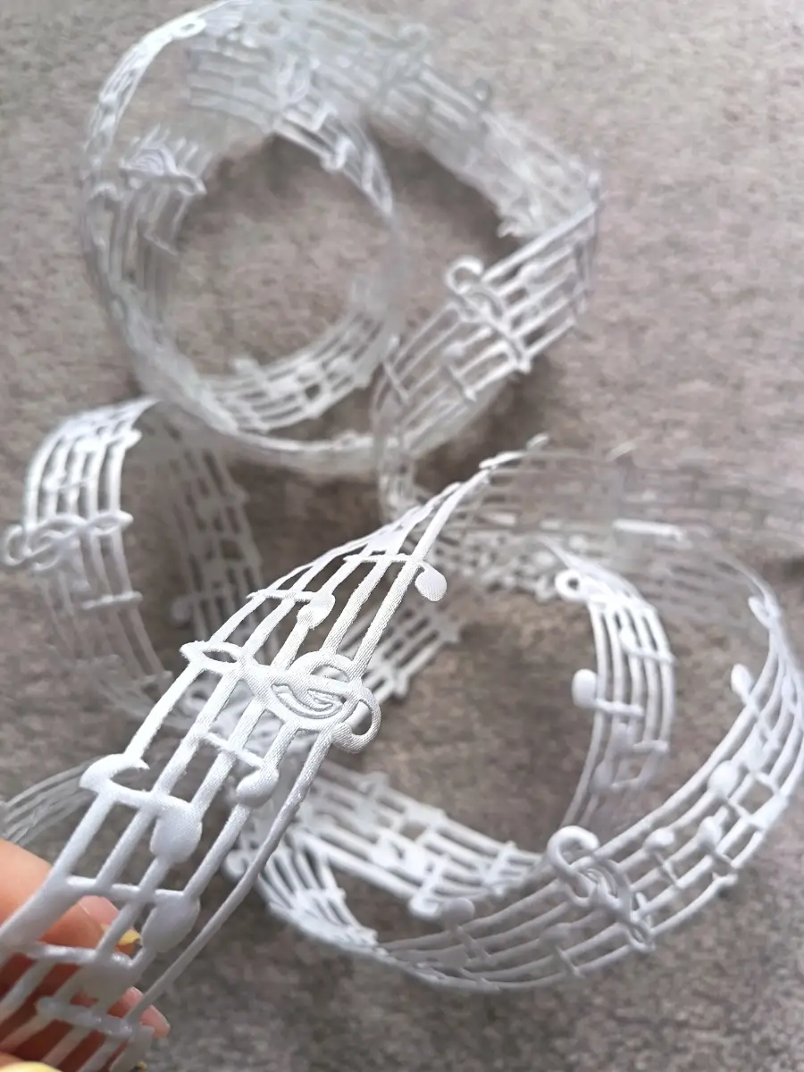 3 metres of white music notes ribbon