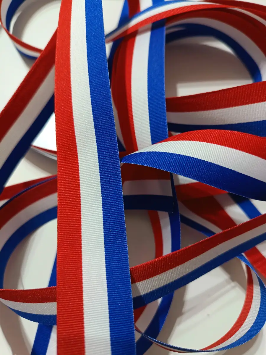 4.15 metres of red white and blue flag ribbon 25mm width. New unused