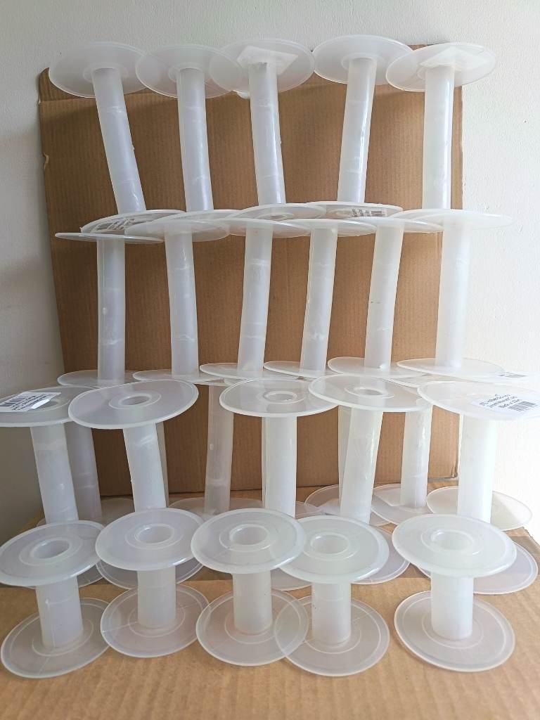 Job lot of 25 plastic bobbins spools reels