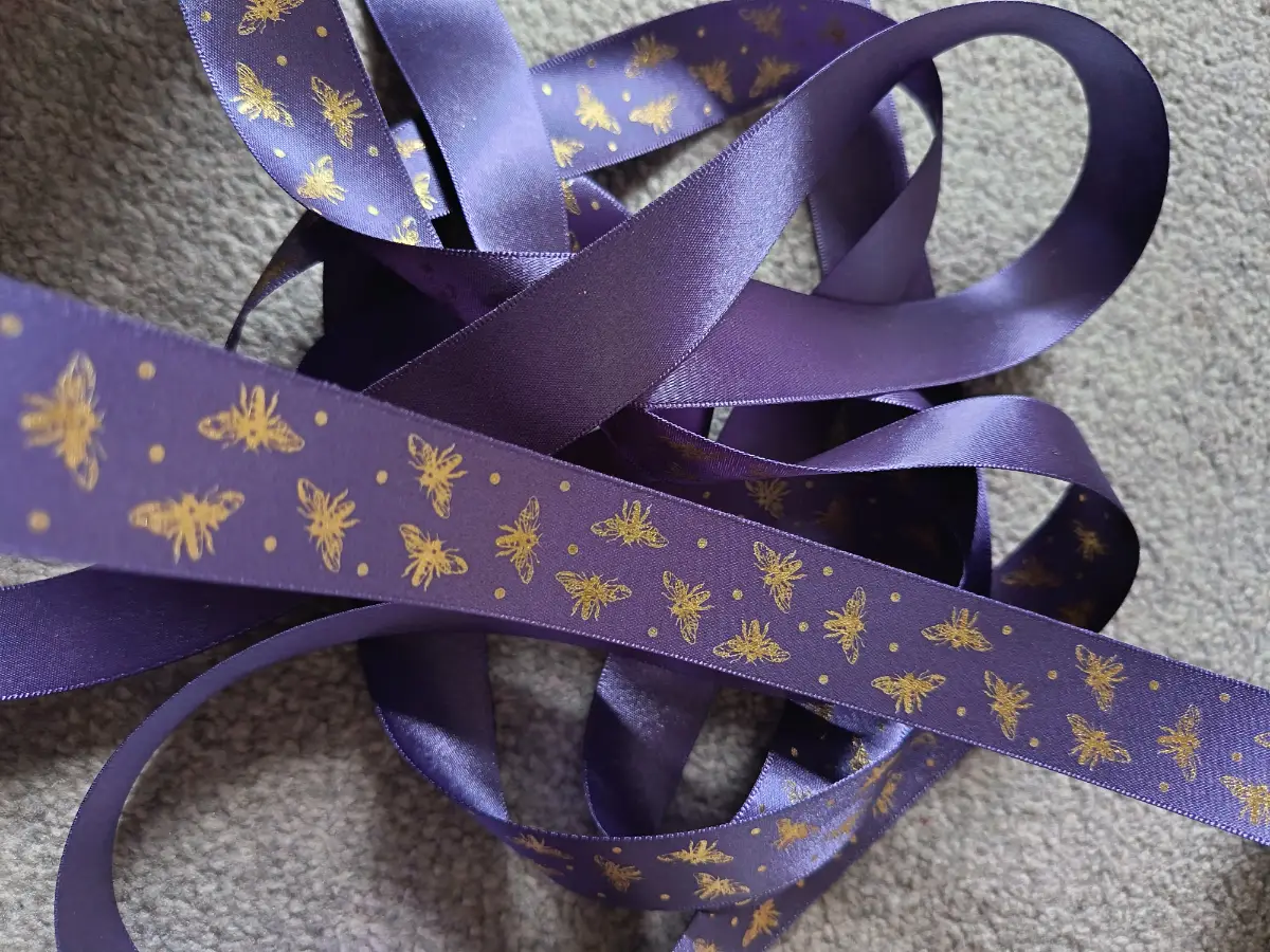 5 metres of Berisfords purple sparkle bee ribbon 25mm width
