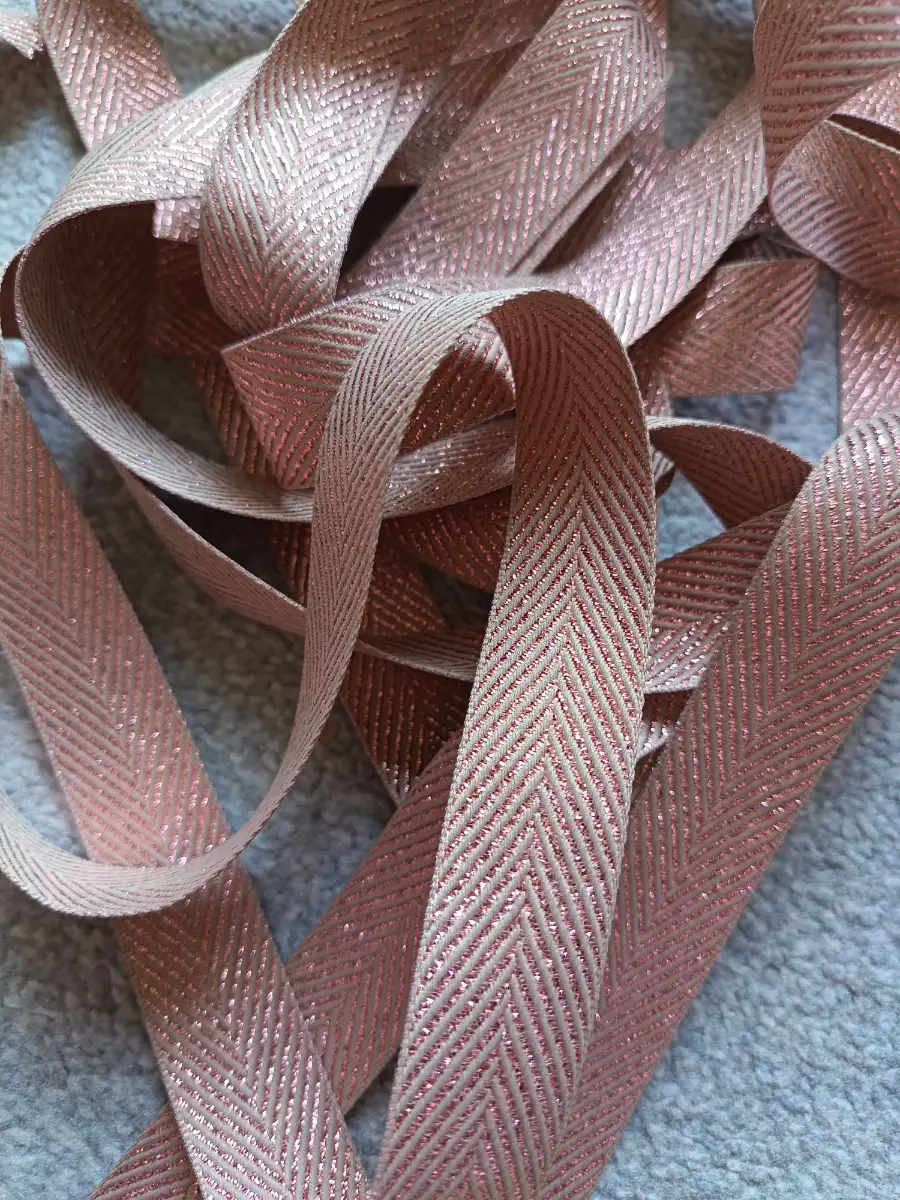 5.15 metres of Berisfords rose gold herringbone 25mm ribbon