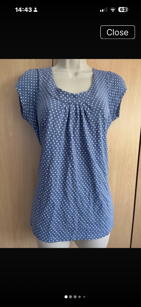 New Look cotton blue top features white polka dots and delicate pleat detailing at the neckline.