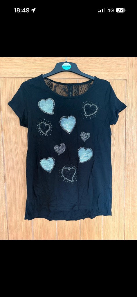 Black top with diamanté and sequin hearts. Lace back