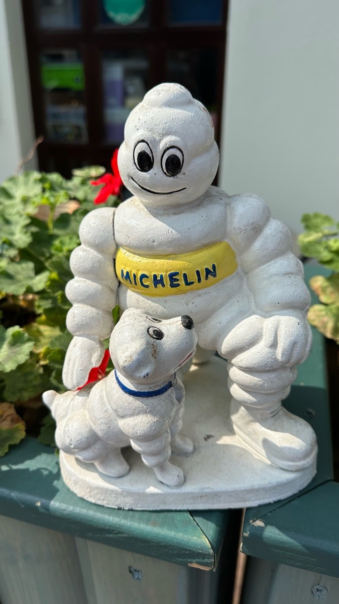 Michelin man with dog cast iron