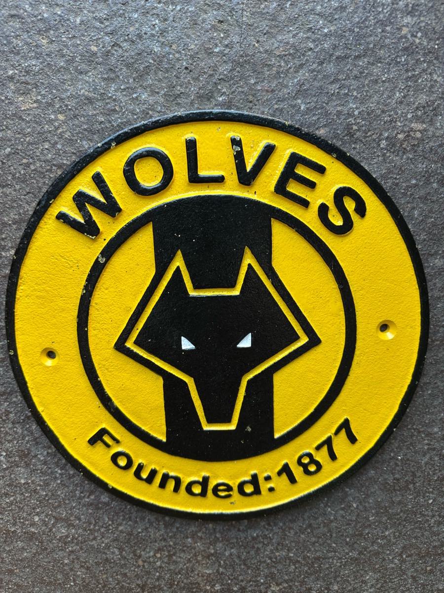 Wolves cast iron sign
