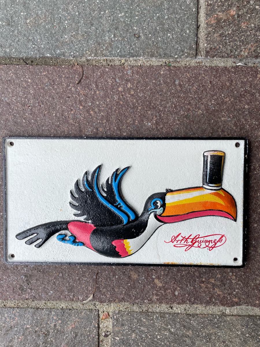 Guinness flying toucan cast iron sign