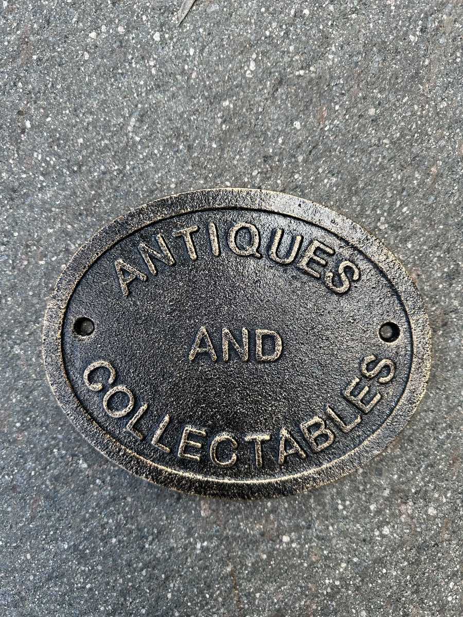 Antiques cast iron sign