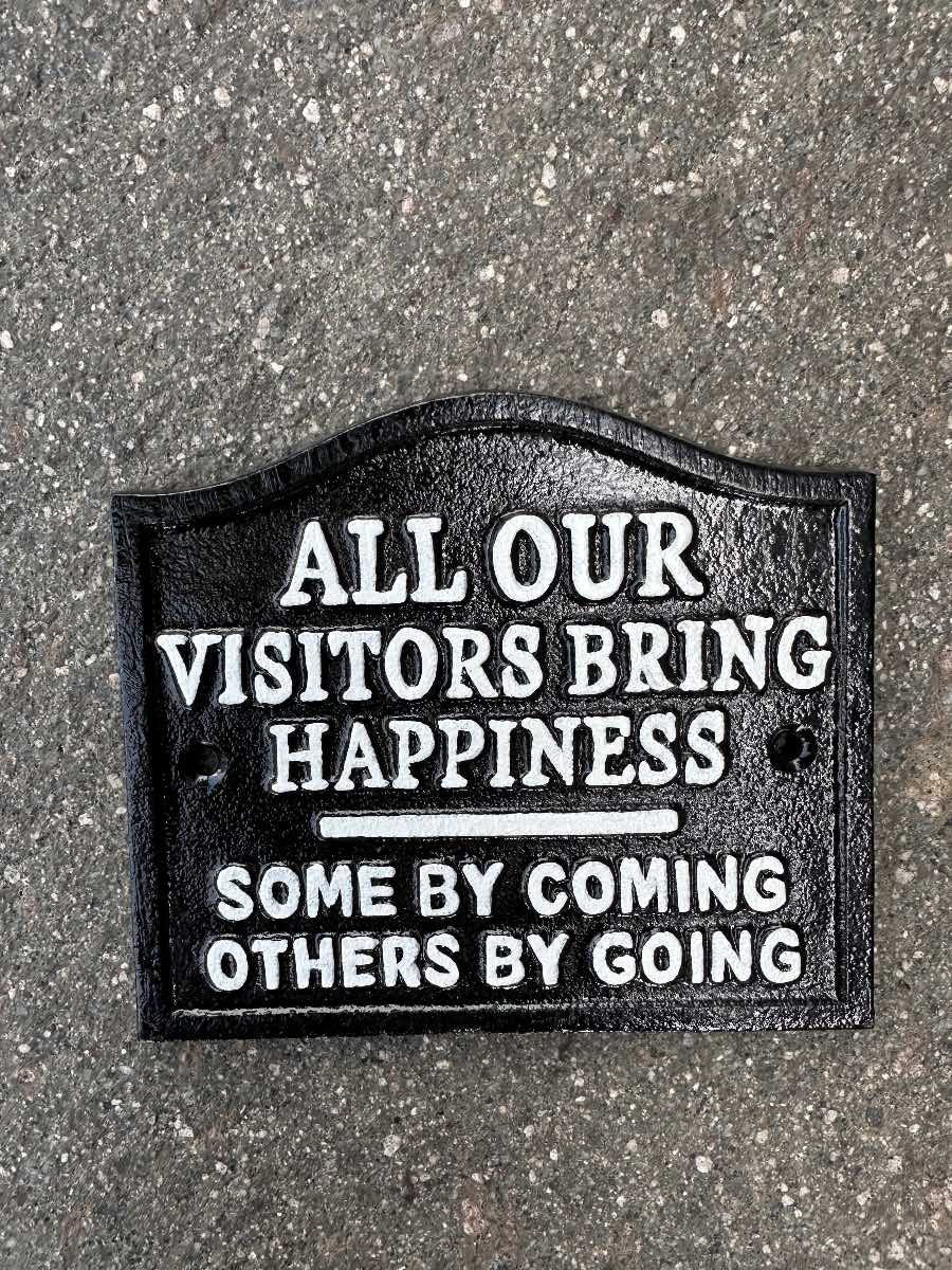 All our visitors bring happiness cast iron sign
