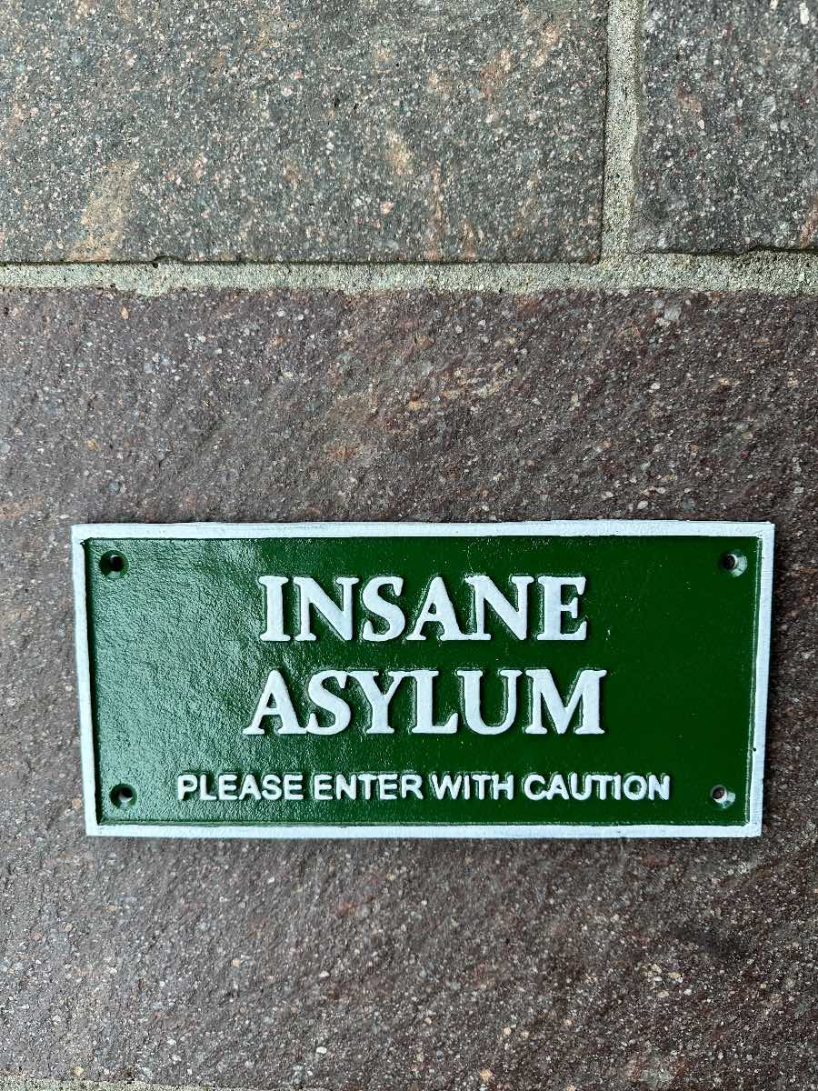 Insane asylum cast iron sign