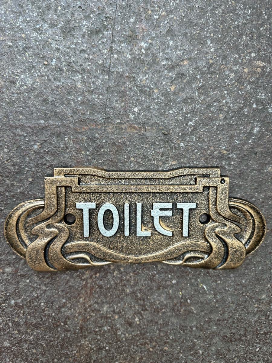 Toilet art deco cast iron style sign