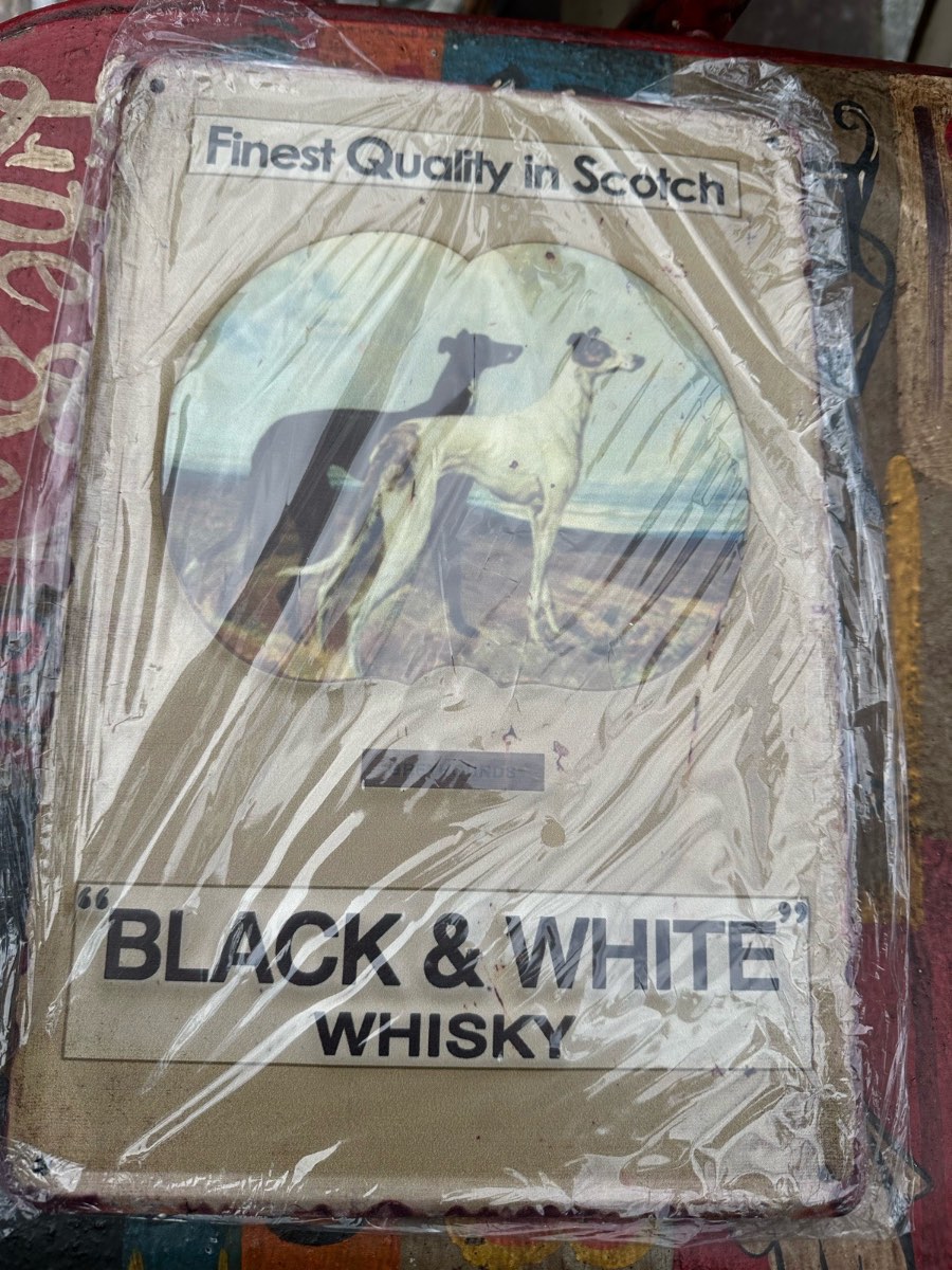 Black and white whisky metal sign