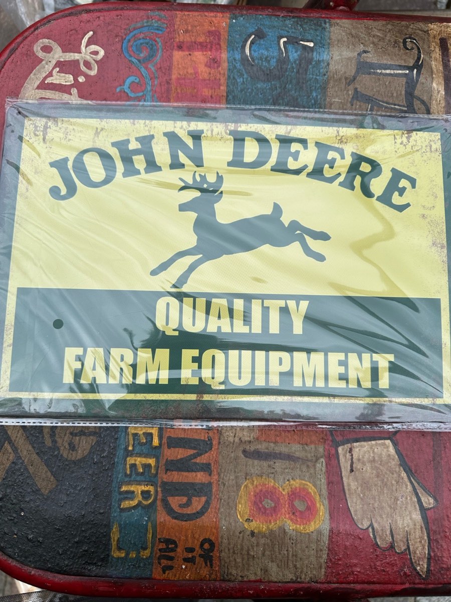John Deere quality farm equipment metal sign