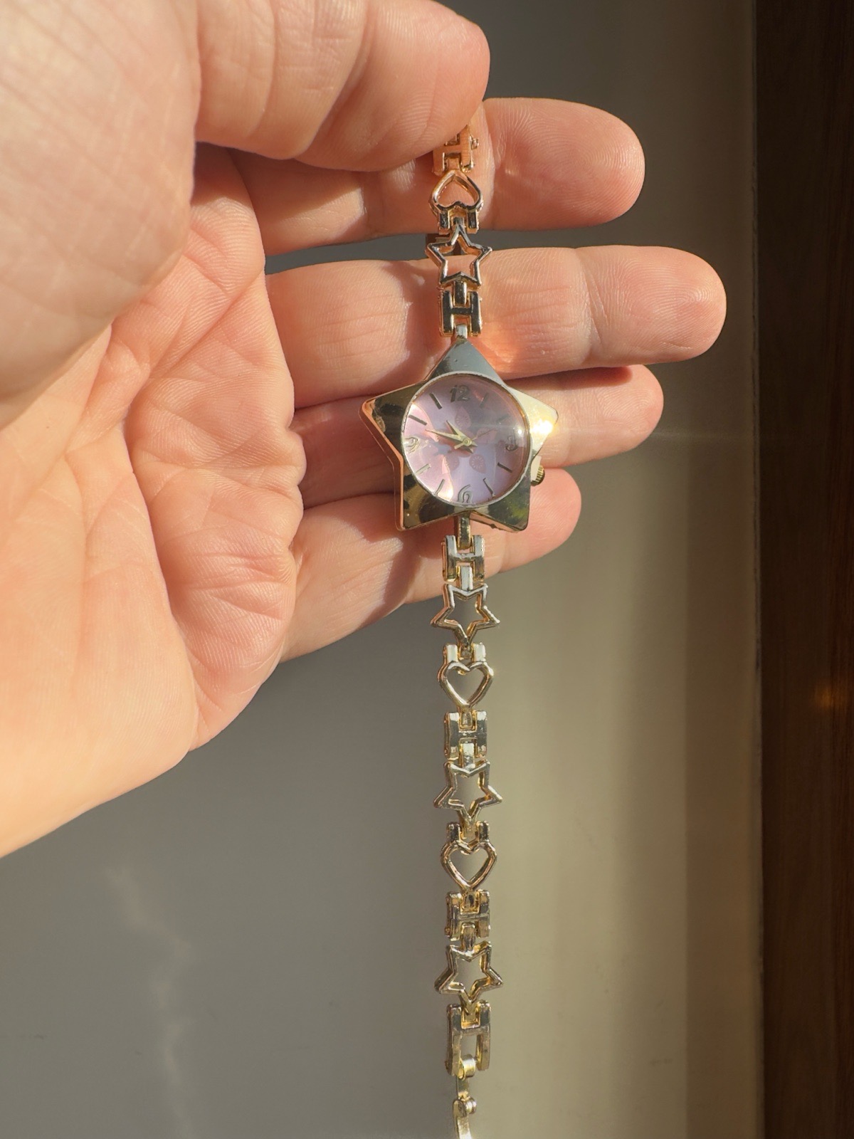 Beautiful wrist watch for ladies with star face in pink