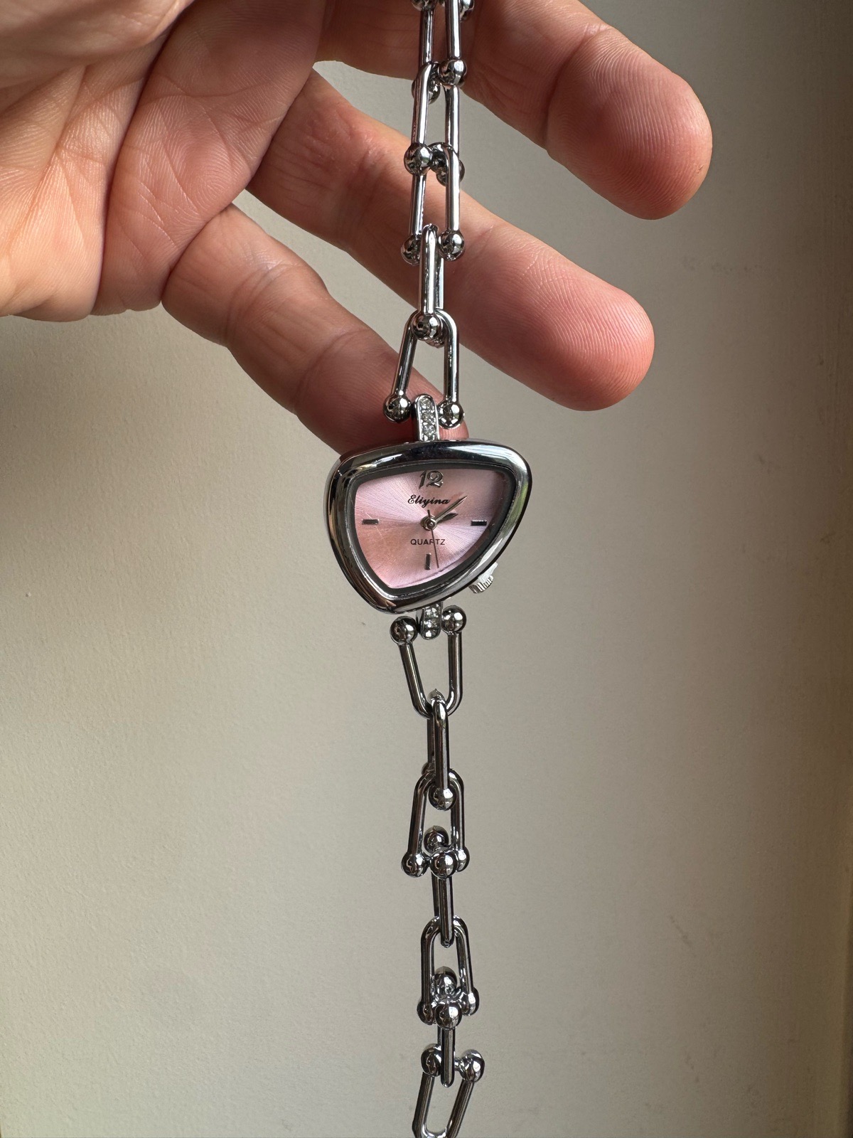 Beautiful wrist watch with irregular pink face