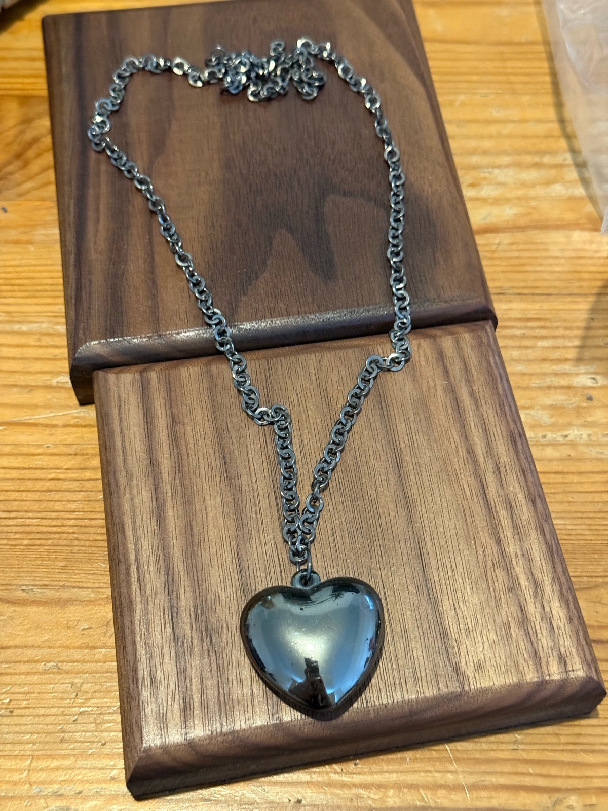 dark metallic heart pendant necklace featuring a polished puffy heart charm