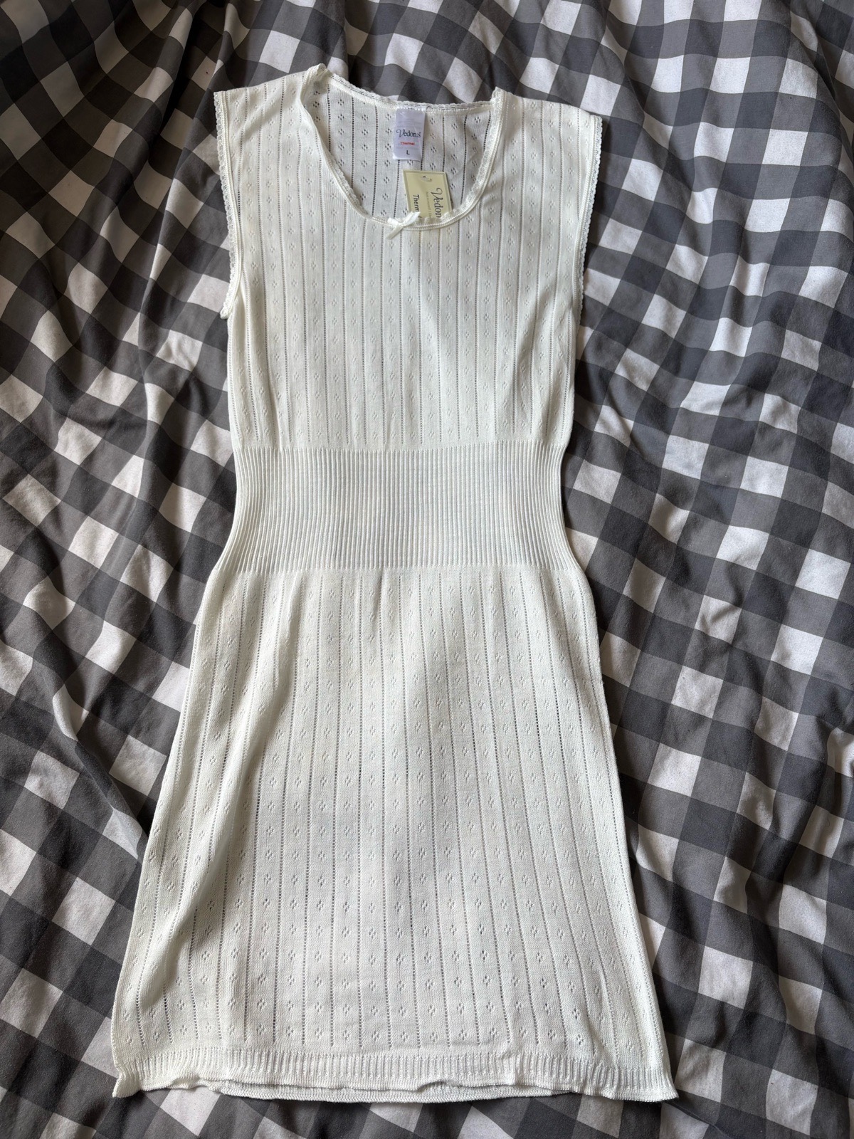 White thermal knit mini dress with small bow on the front