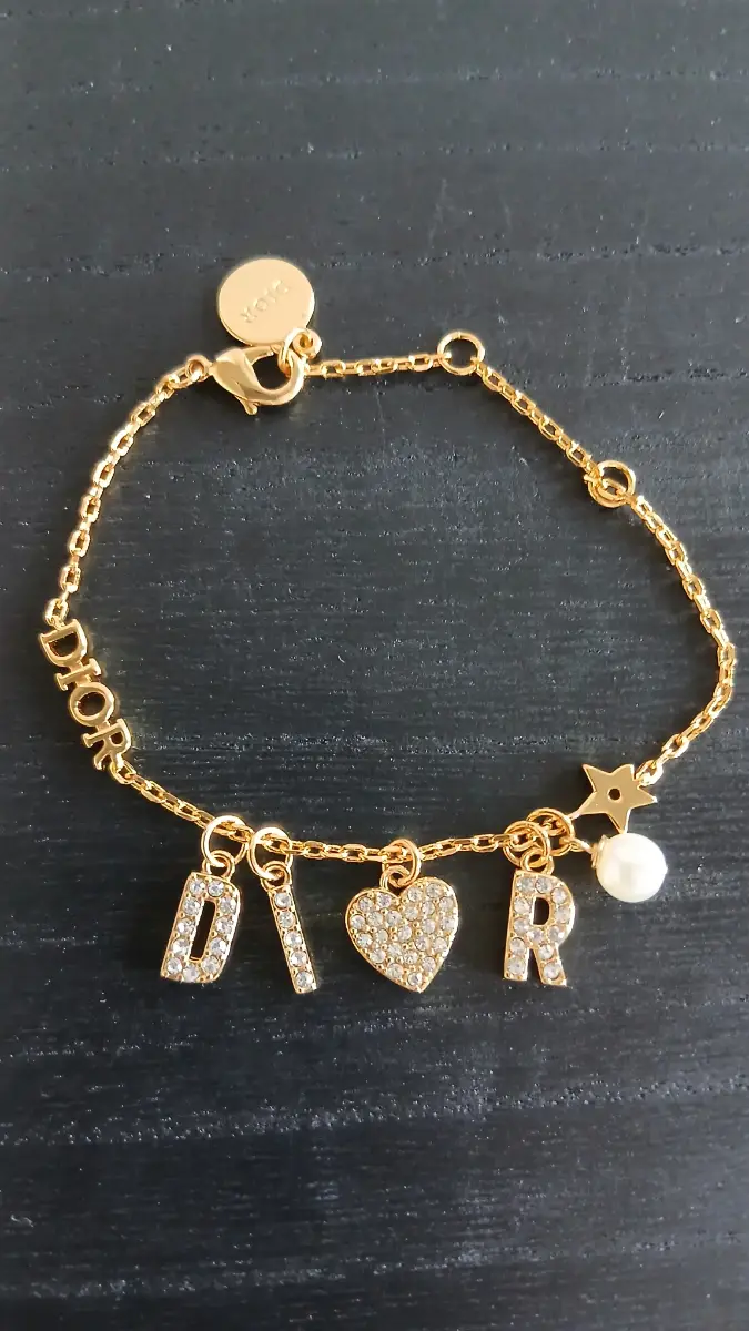 Gold-tone multiple charm adjustable length bracelet