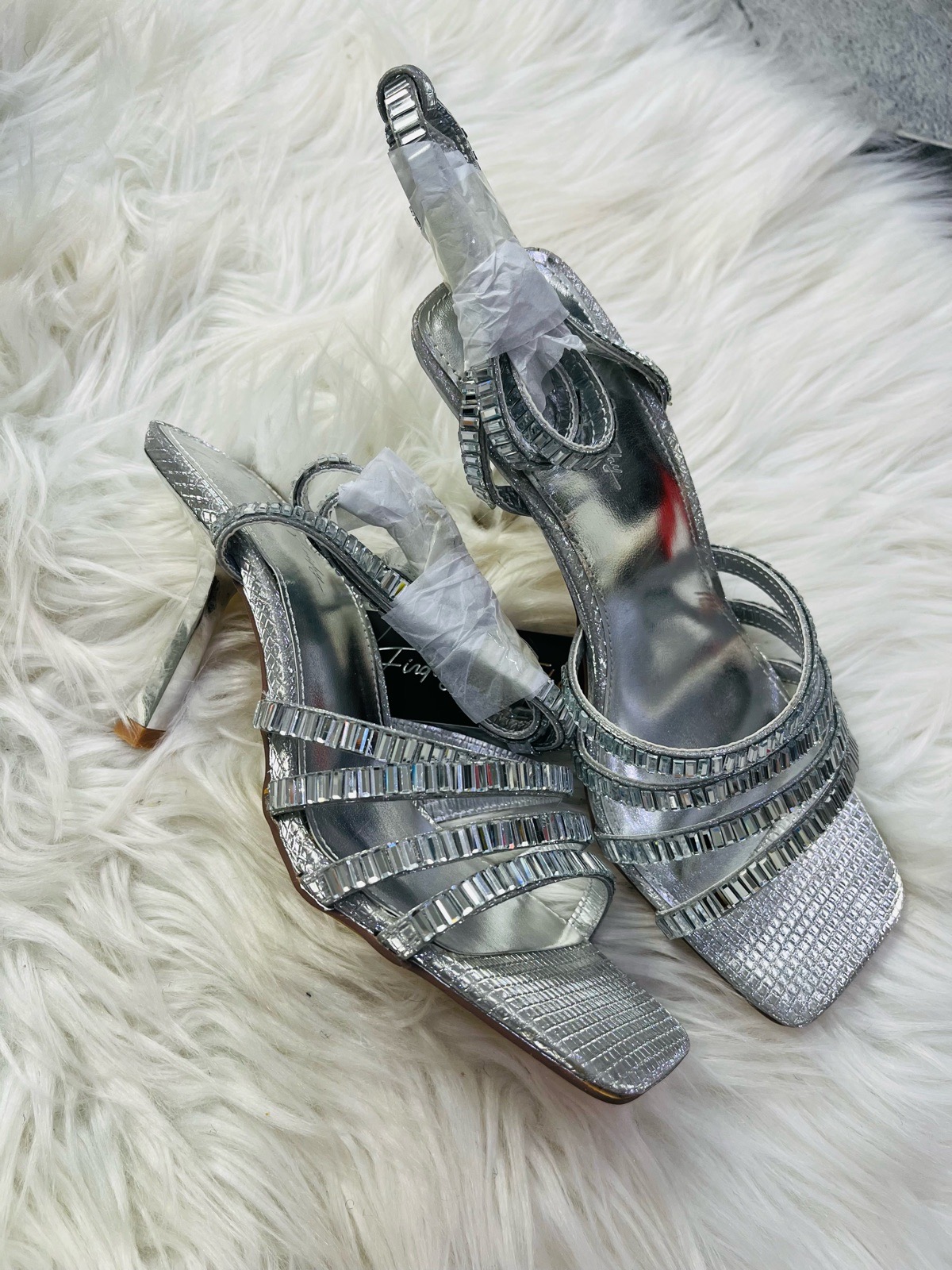 Finding Friday silver heel with wrap around leg straps