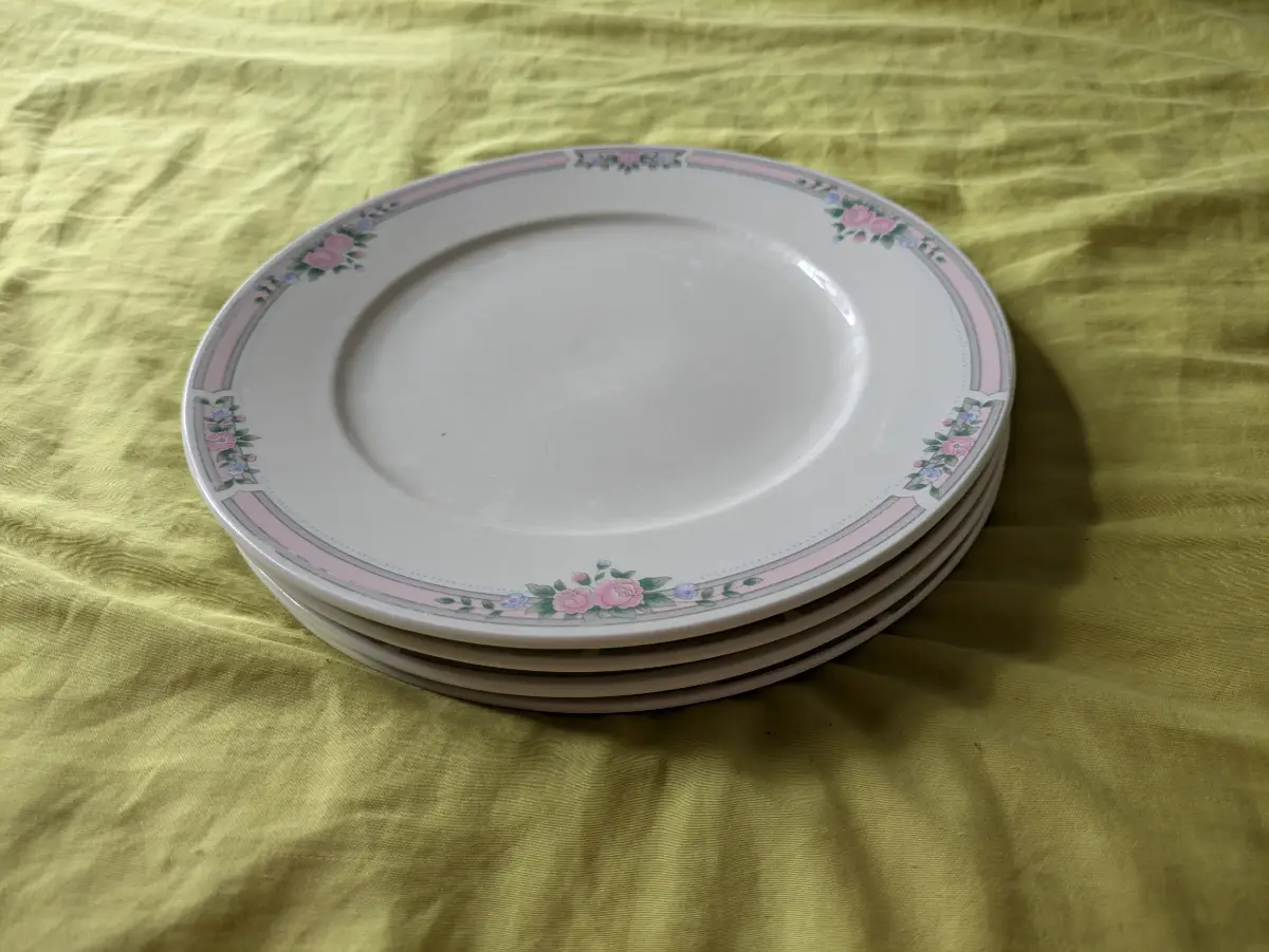 Set of four 10" ceramic dinner plates with pink and grey floral design