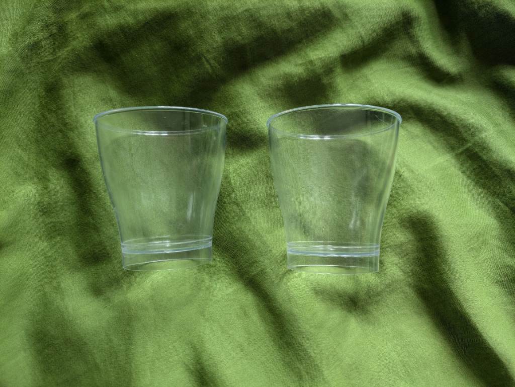 Two stackable plastic single serve cone dessert moulds for setting jelly, custards storage etc