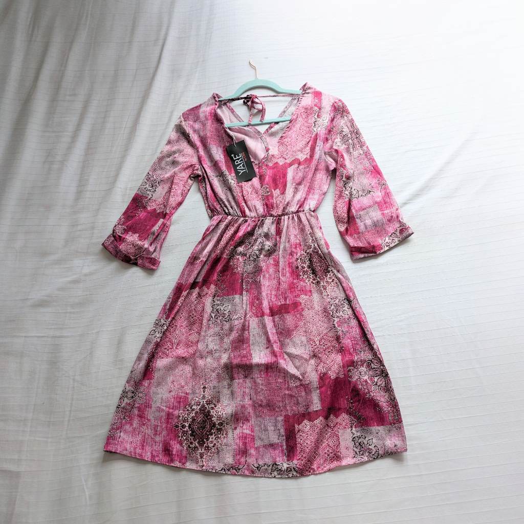 VNeck, silky fit and flare dress with a concealed snap button at the chest and elastic waist UKS New
