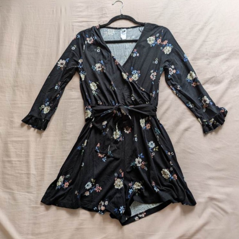 Pure cotton black, belted floral playsuit with 1/2 ruffle sleeves, deep V neckline and attached belt