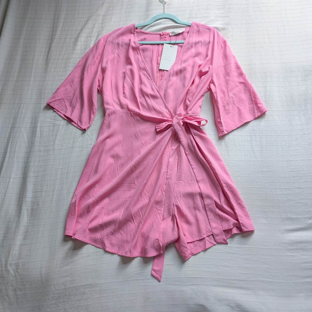 Pink drapey front wrap playsuit with long side tie and flared kimono style short sleeves UKL