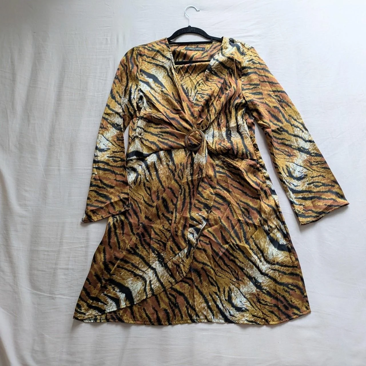 Tiger print mock wrap dress with long sleeves and front tortoiseshell buckle New