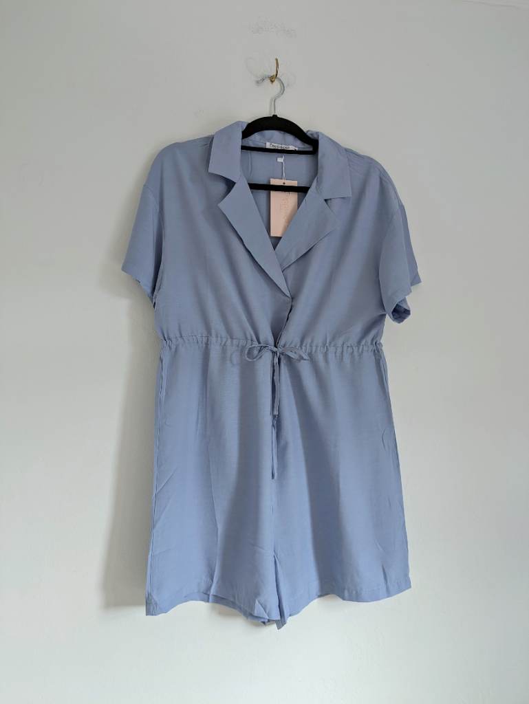 Blue summer beach playsuit with drawstring waist, lapel collar & snap button