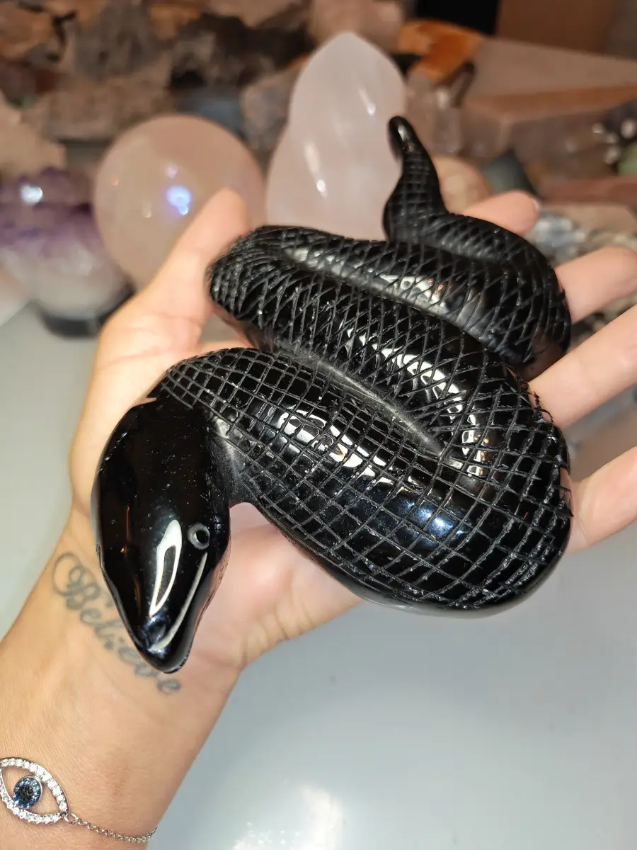 Black obsidian crystal snake carving