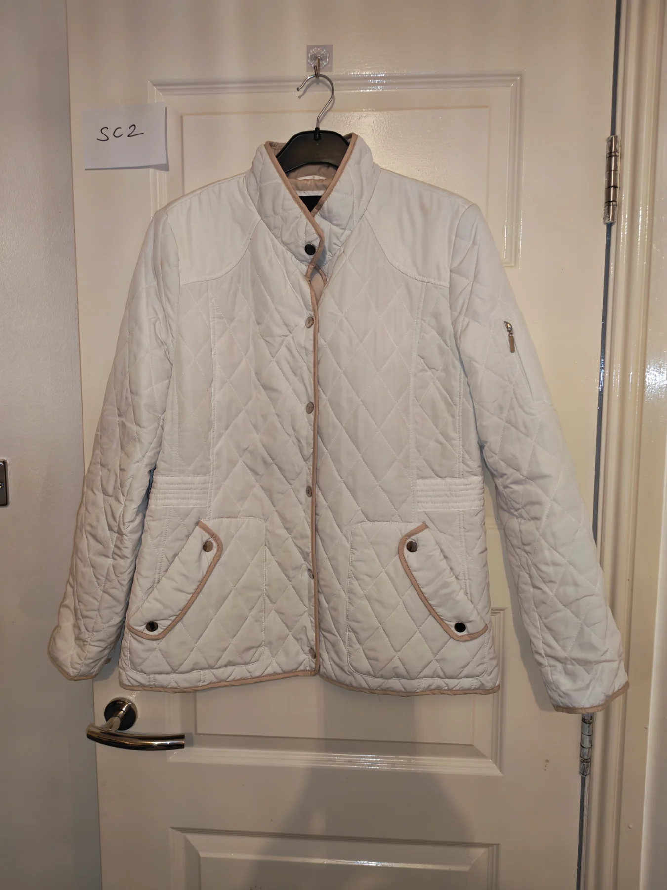 Weatherproof woman's size large cream padded jacket