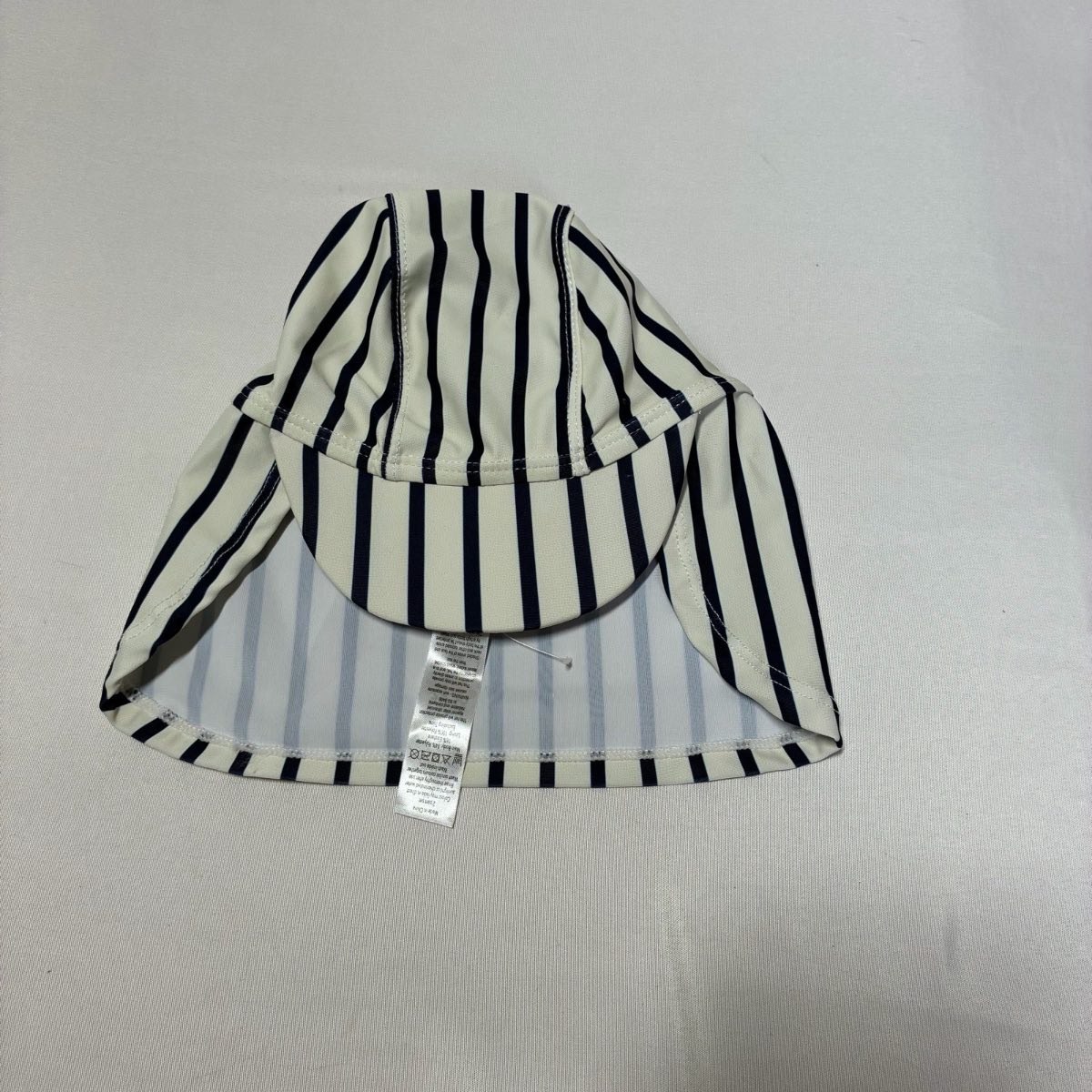 Boys cream and navy striped swimming hat 9-12 months  George