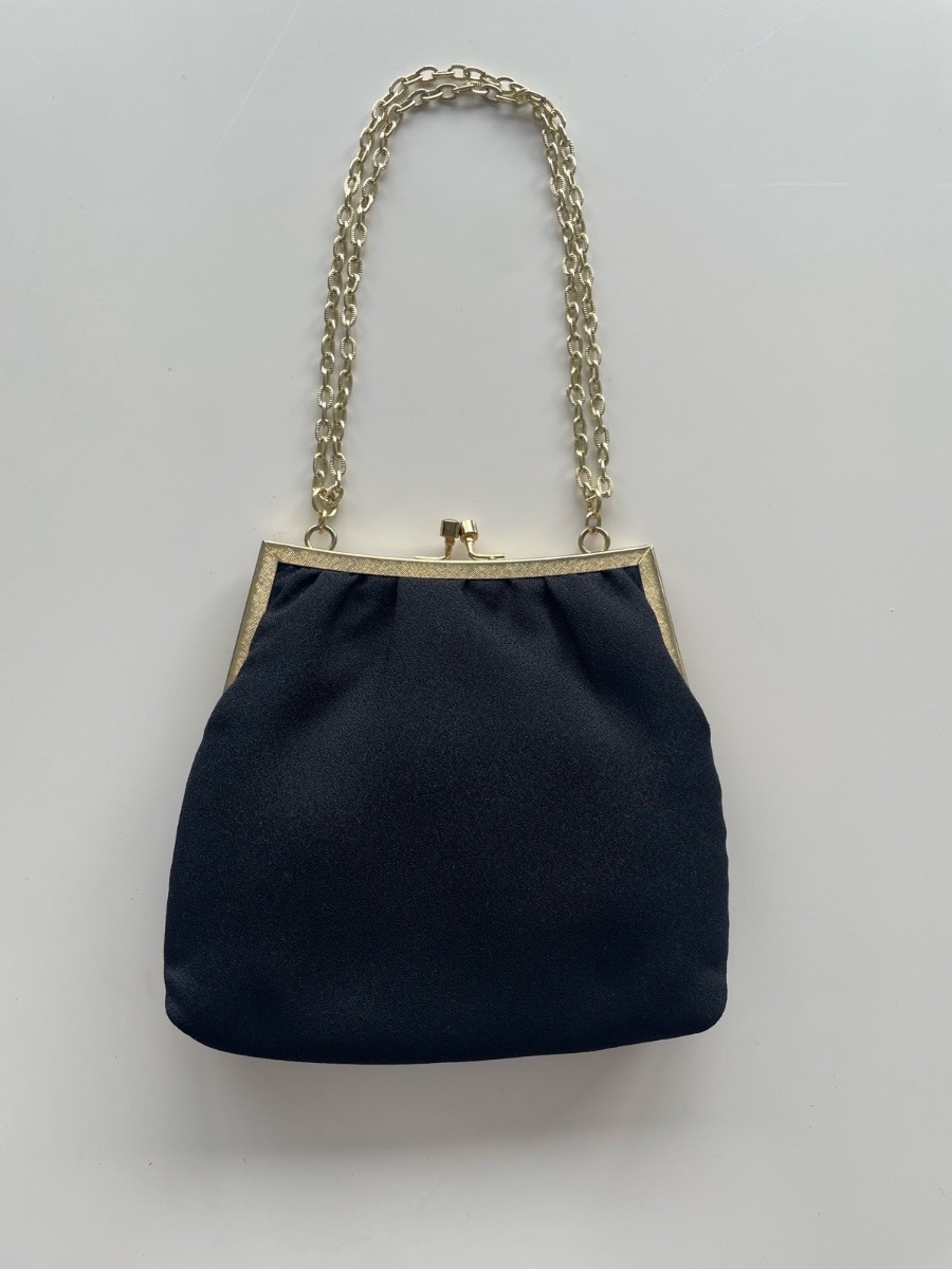 Small black and gold handbag.
