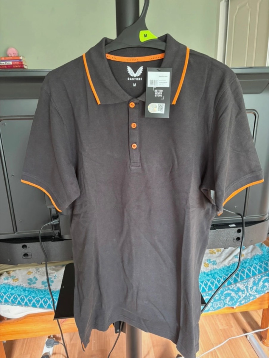 Black (Orange Trim) Castore Polo Shirt.