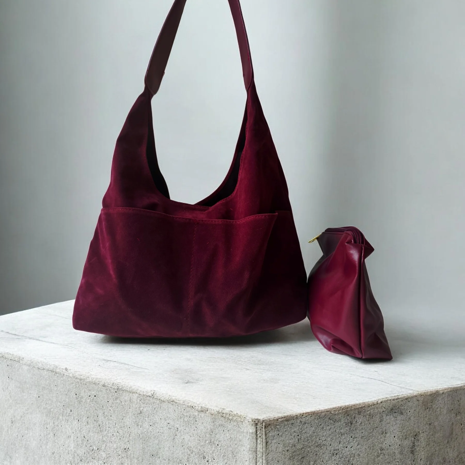 Burgundy faux suede hobo bag with a small pouch