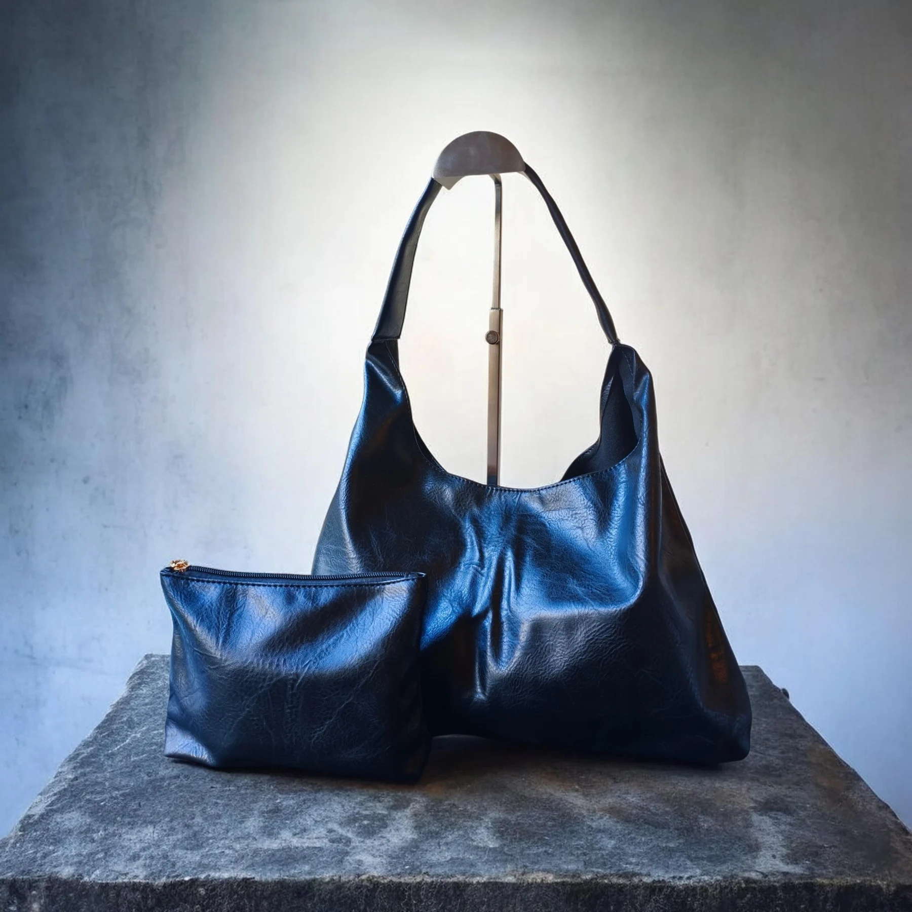 Black hobo bag with a small pouch