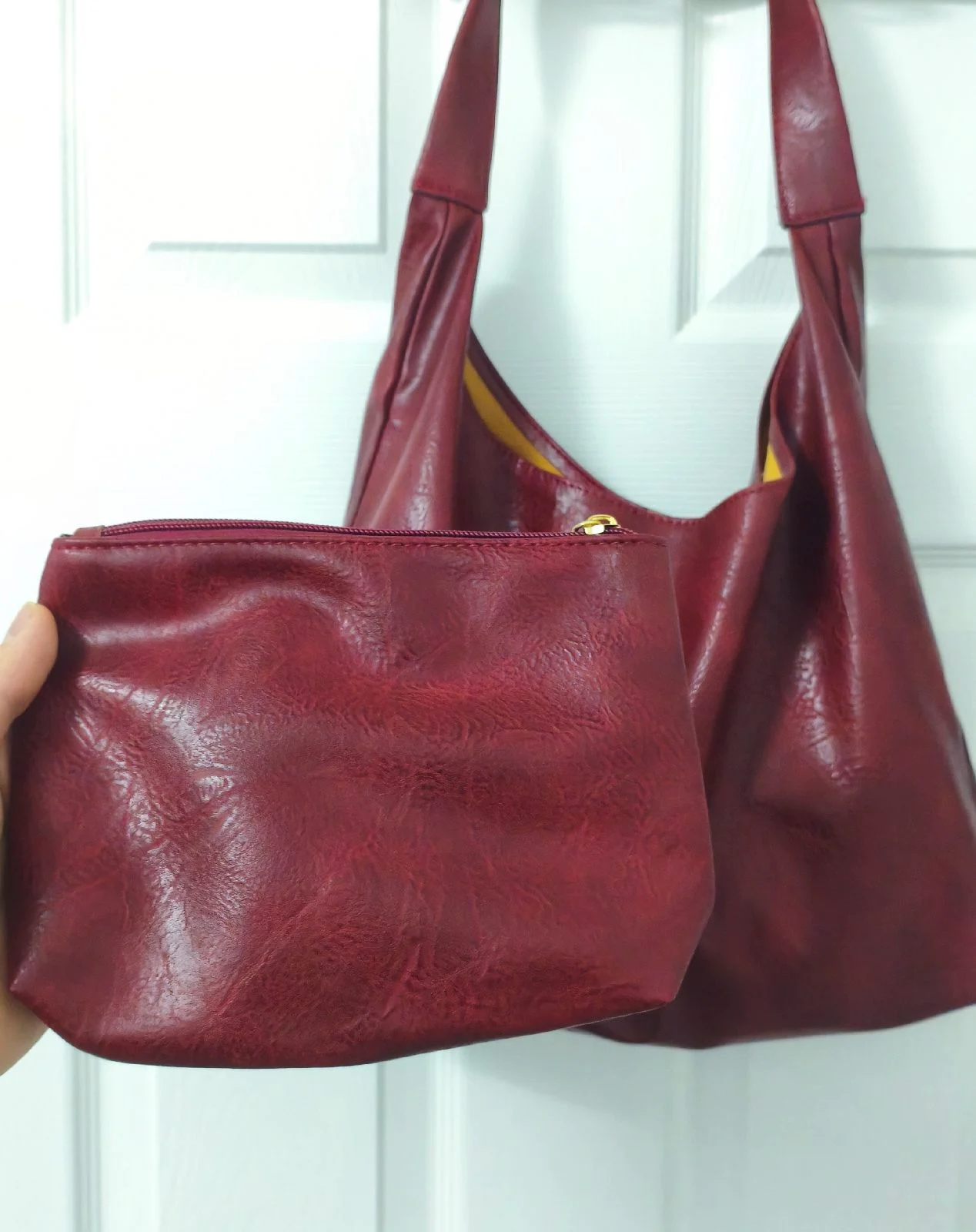 Burgundy women's hobo bag with a small pouch