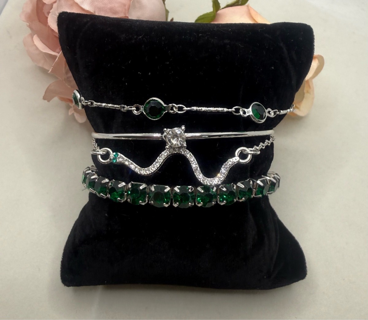 Set of 4 sliver plated and faux emerald bracelets