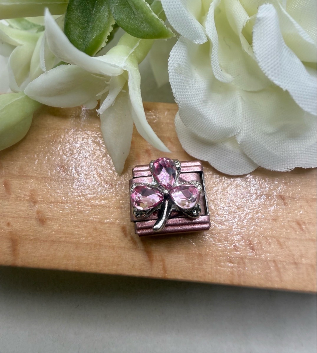Pink coloured crystal flower link charm