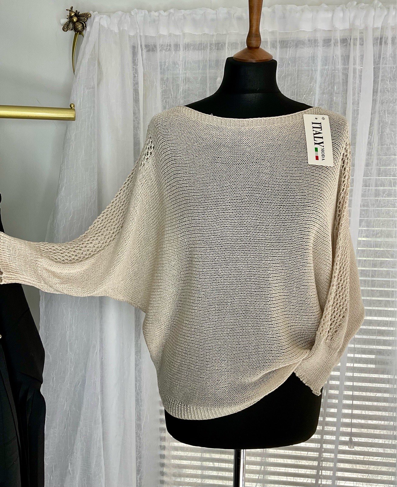 Open Knit Batwing Top. 4/4 Length Sleeves. Bow Detail Back. One Size 8-16 Cream