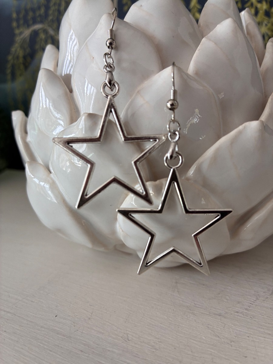 Long silver tone star earrings