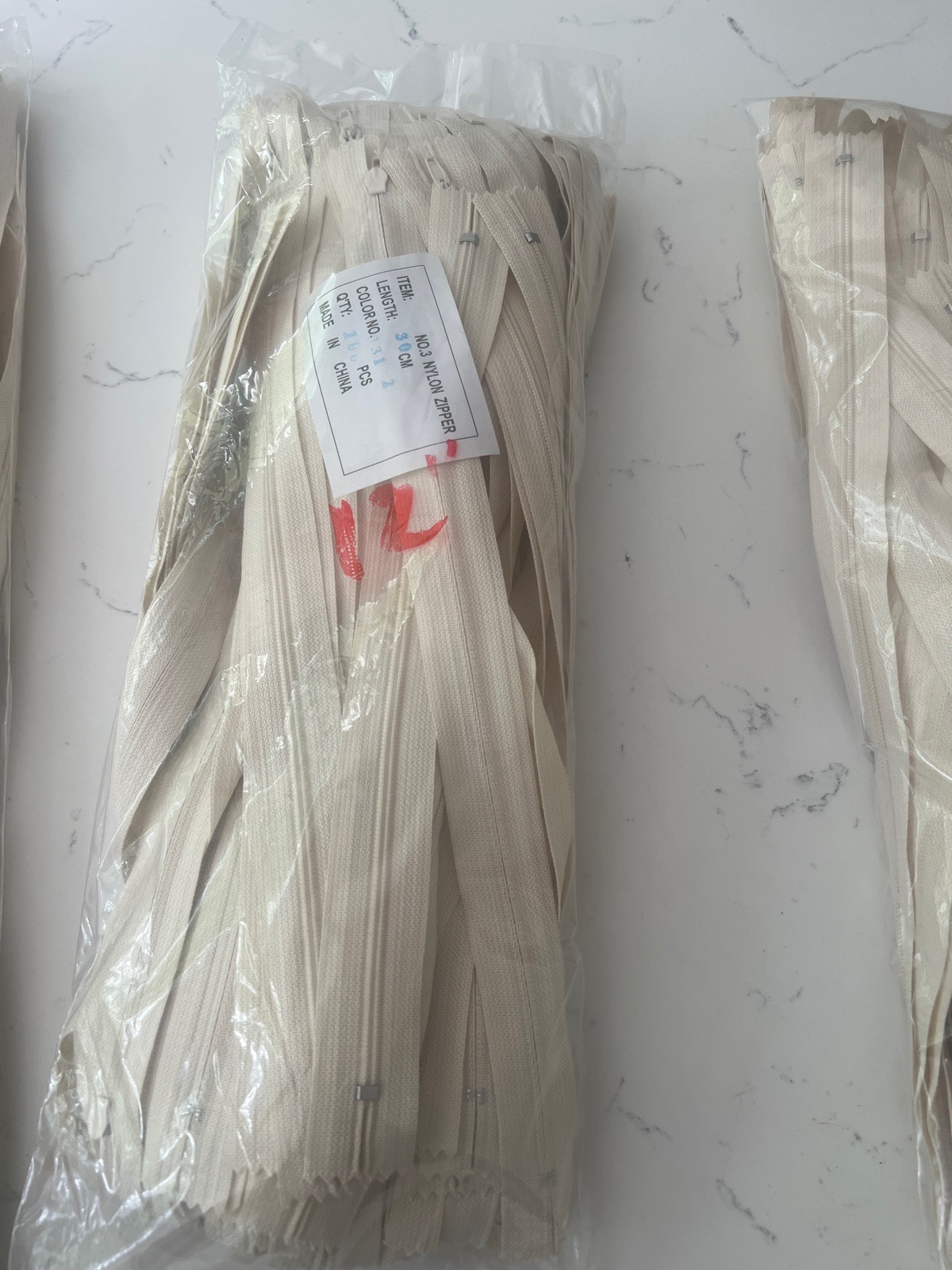 10 x 12” cream cushion zips