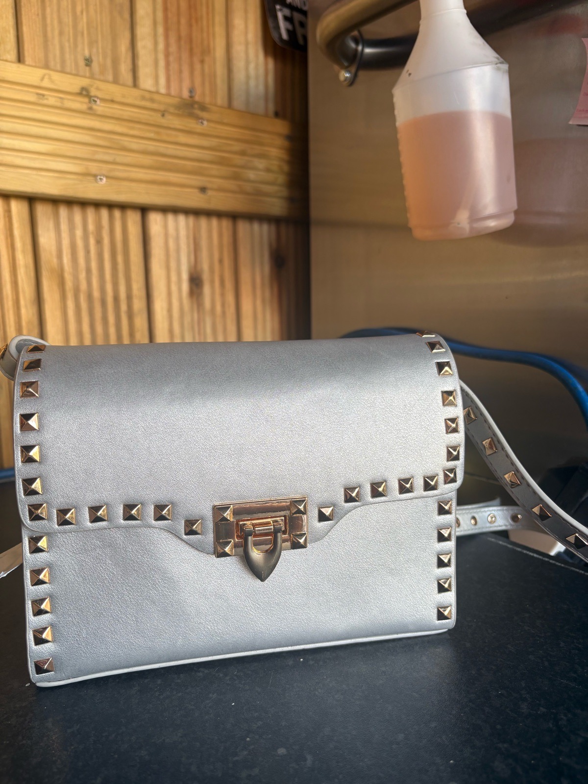 Silver studded shoulder bag.