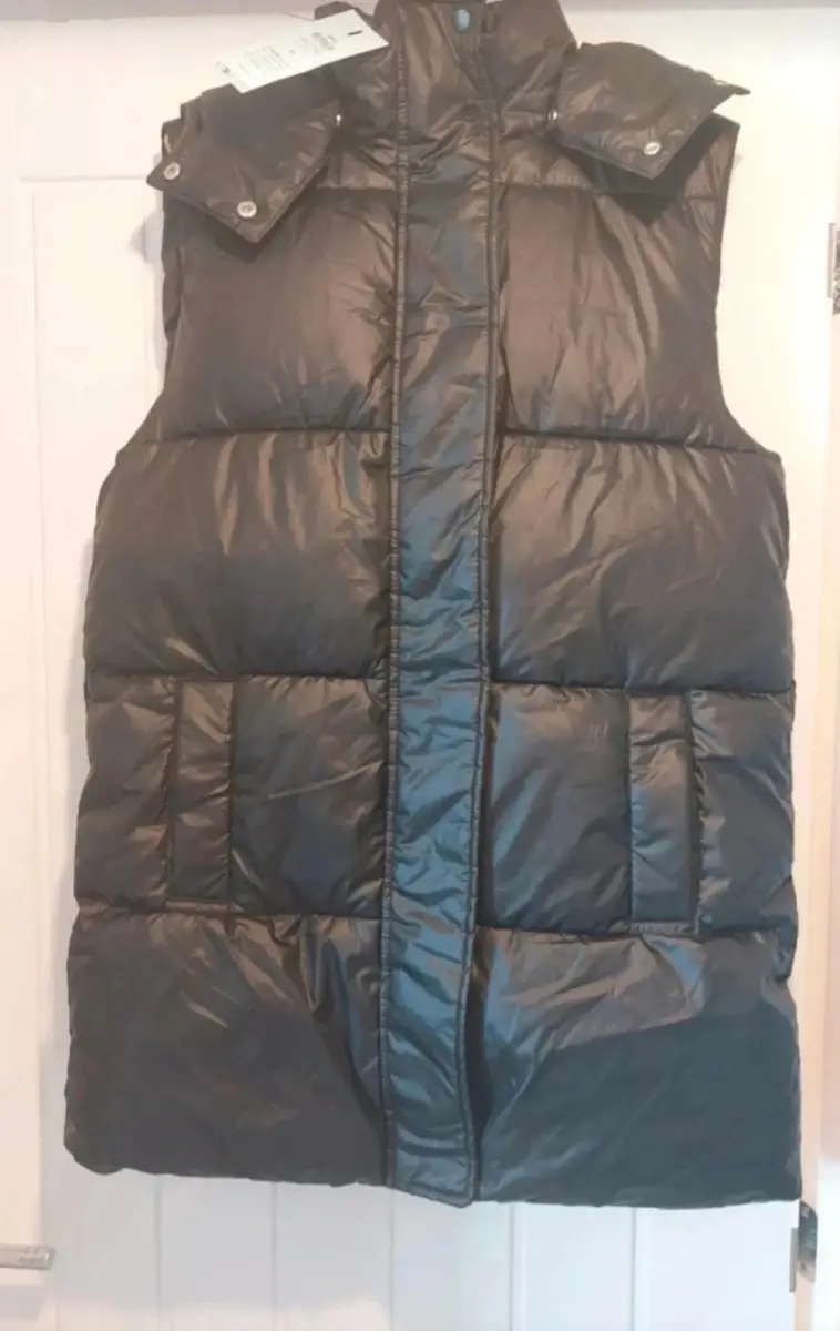 Only women's size XS black gilet. Brand new with tag