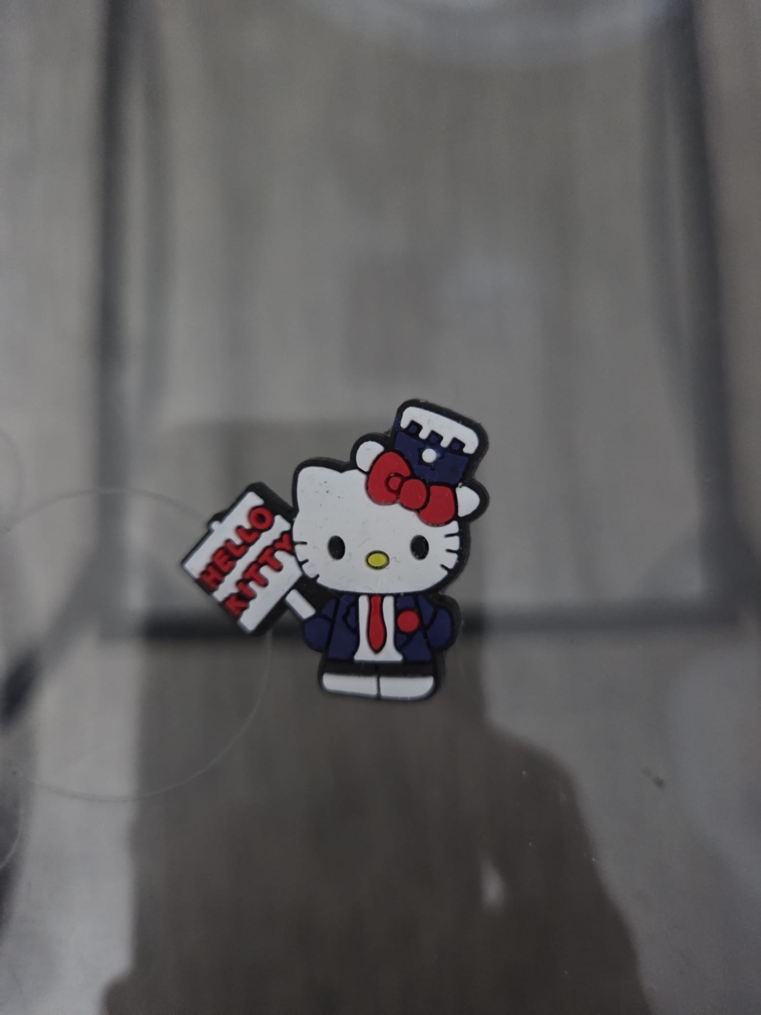 Suited Hello Kitty Shoe Charm.