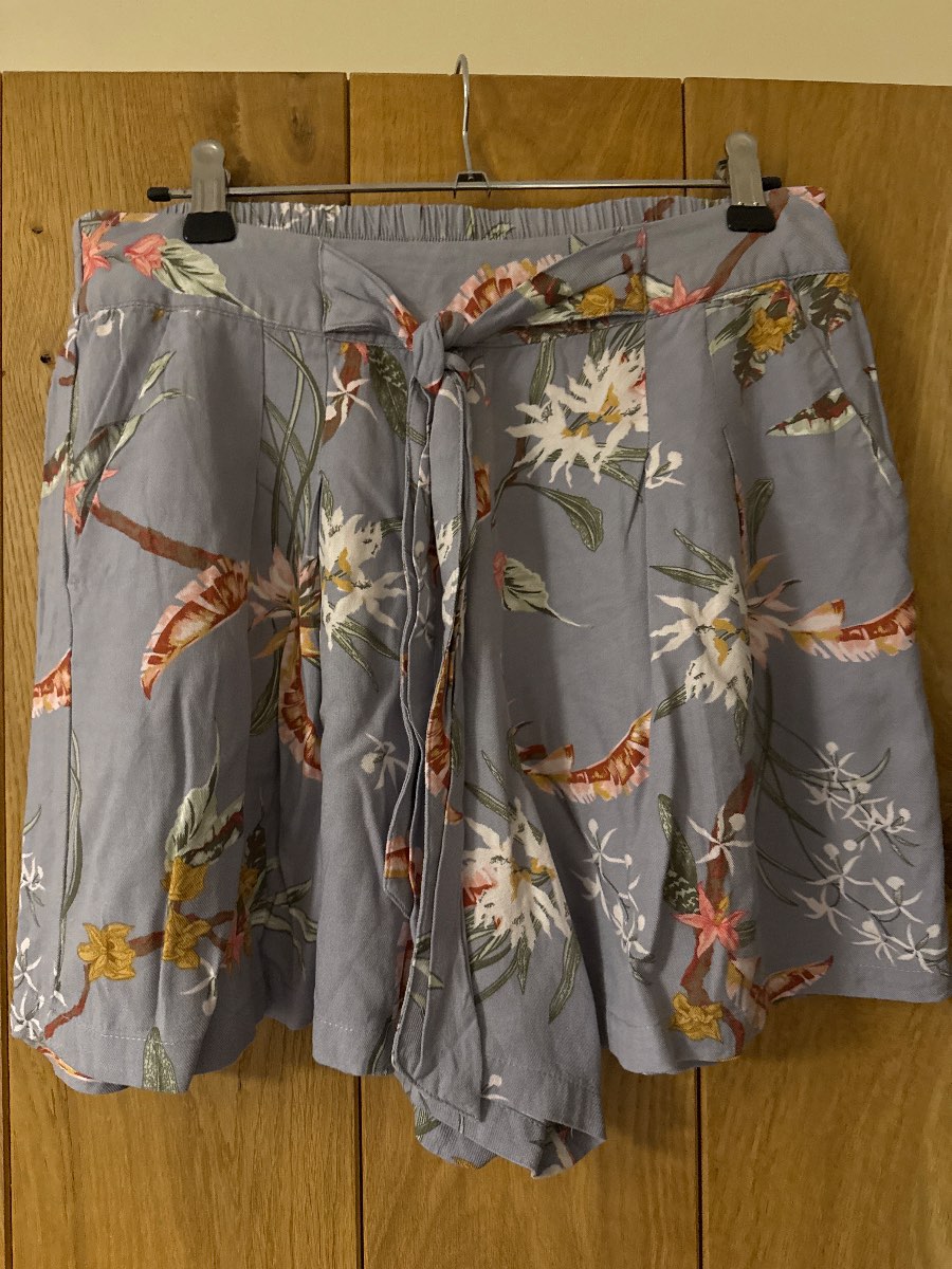 Floaty grey with floral pattern shorts size 10