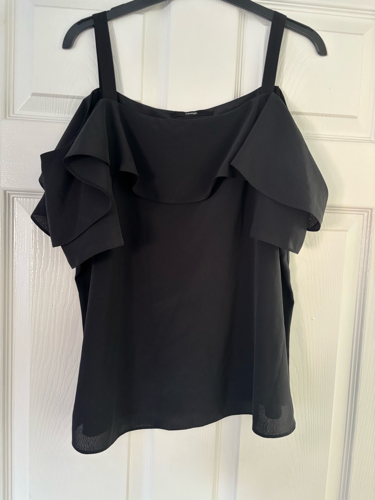 Women’s black frilly top size 14