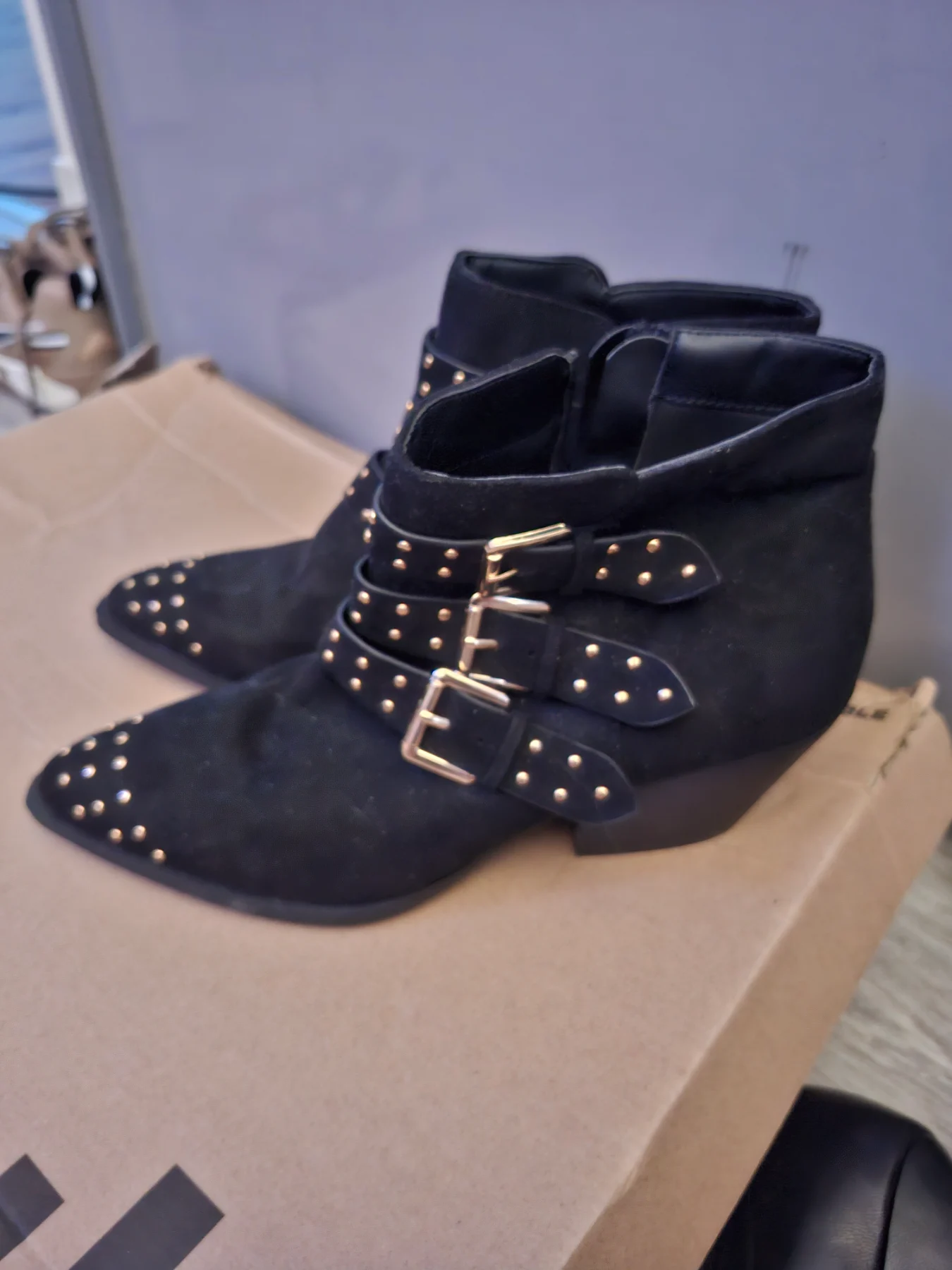Black and gold boots