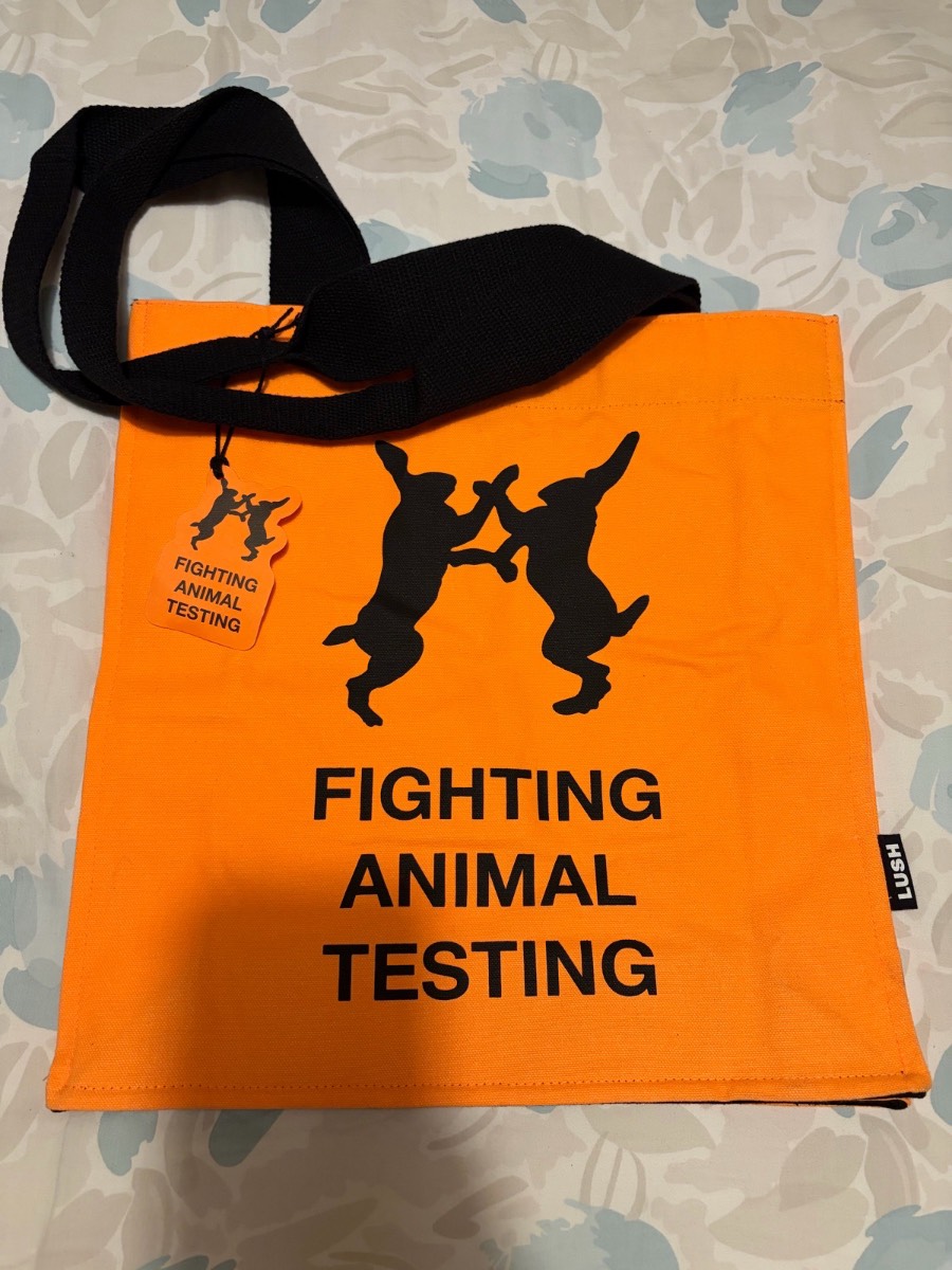 Lush Cosmetics tote bag. Orange and black. RRP £20.00. New with marks on